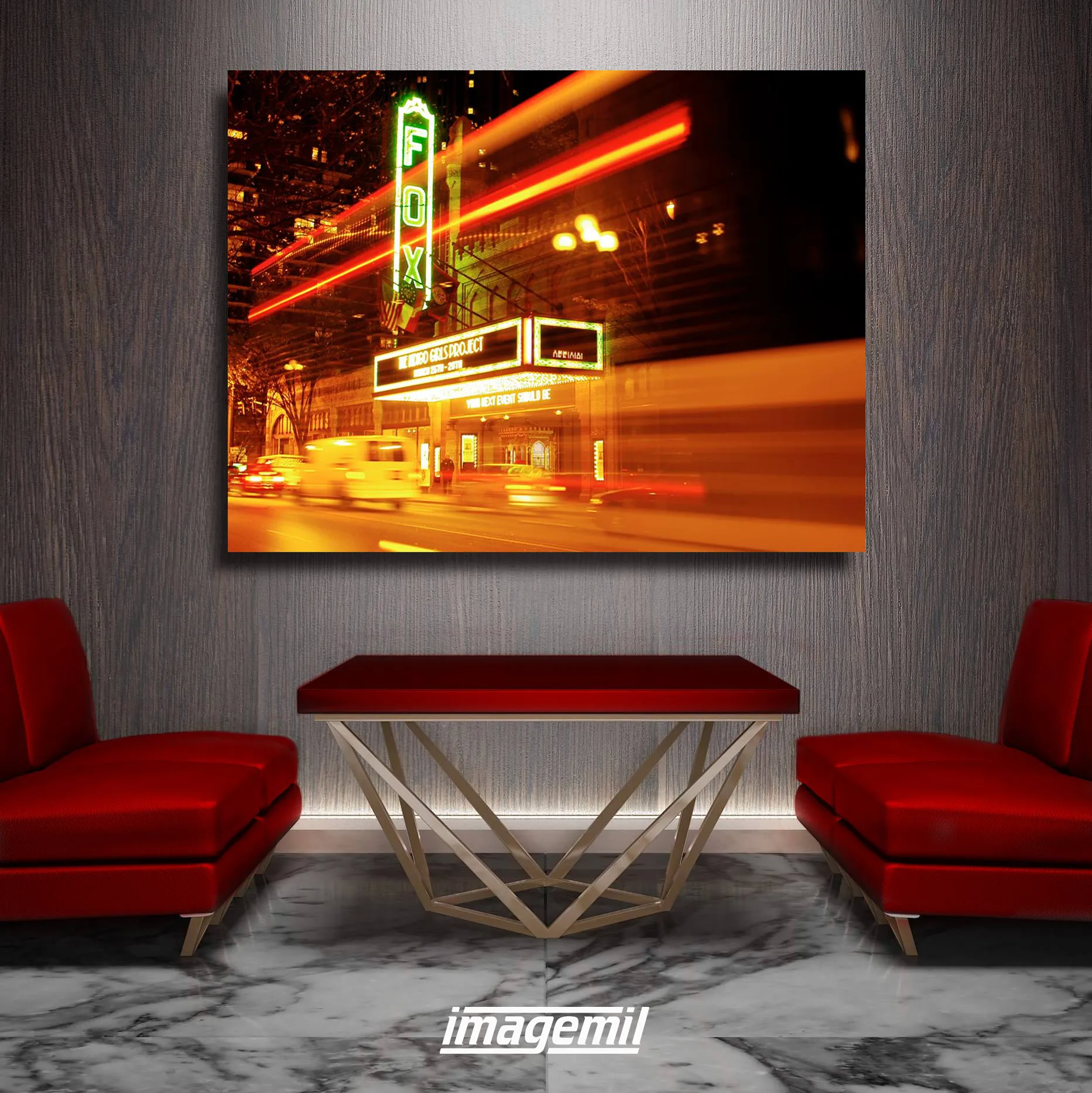 The Fox Theatre marquee at night, printed large above red chairs