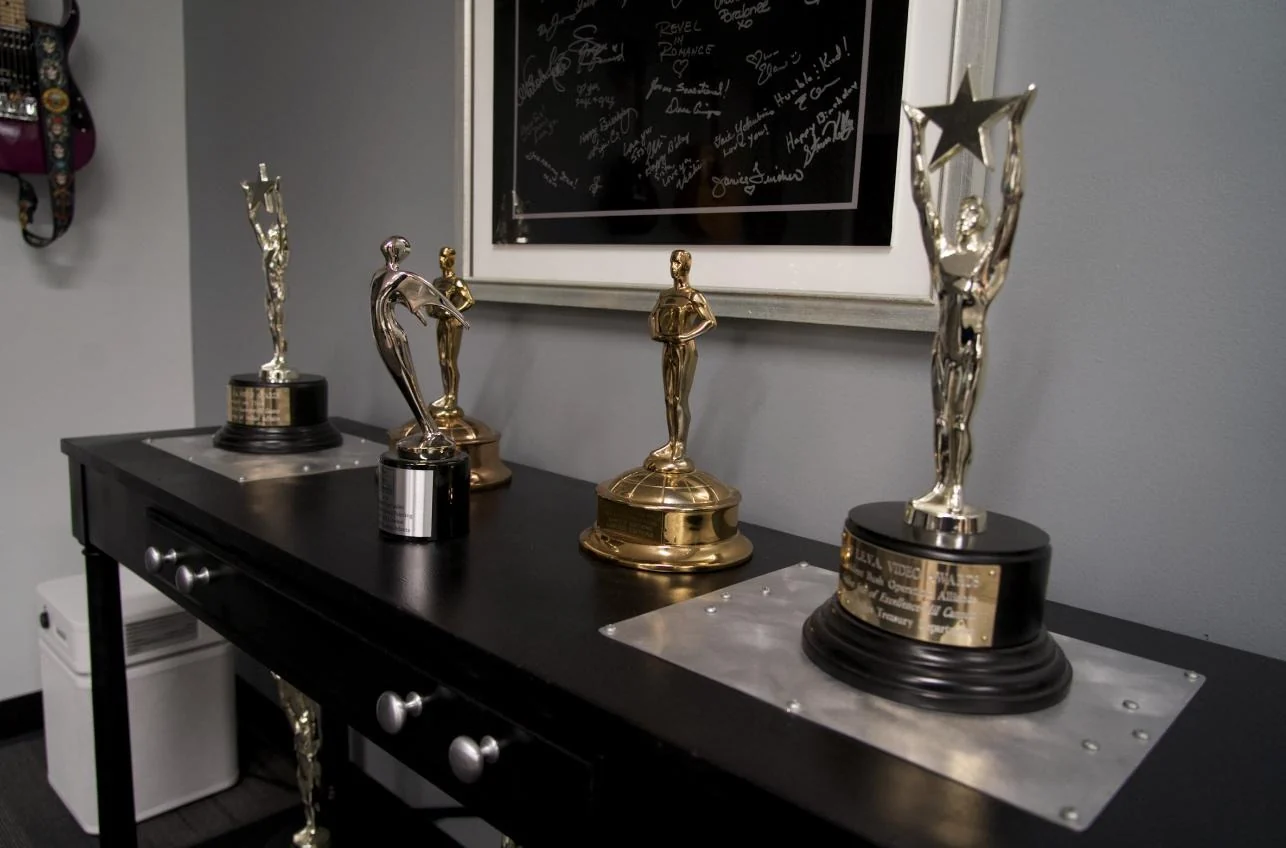 A collection of awards and trophies from ImageMil projects